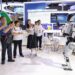 Pengunjung memotret robot humanoid di area ekshibisi Manufaktur Digital dan Pintar Negara-Negara Eropa Tengah dan Timur (Central and Eastern European Countries/CEEC) dalam China-CEEC Expo & International Consumer Goods Fair keempat di Ningbo, Provinsi Zhejiang, China timur, pada 22 Mei 2025. (Xinhua/Jiang Han)