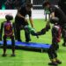 Sebuah robot dari tim Mountain Sea dari Universitas Pertanian China dibawa dengan tandu dalam pertandingan sepak bola robot berbasis kecerdasan buatan (artificial intelligence/AI) di Beijing, ibu kota China, pada 28 Juni 2025. (Xinhua/Zhang Chenlin)